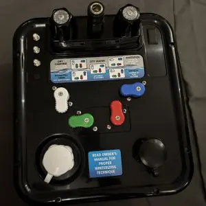 B&B Molders Nautilus P4 H2O RV water control panel in black with color-coded diverter handles