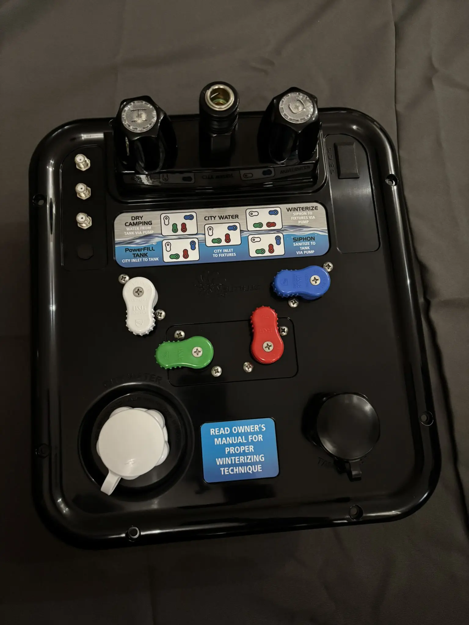 B&B Molders Nautilus P4 H2O RV water control panel in black with color-coded diverter handles