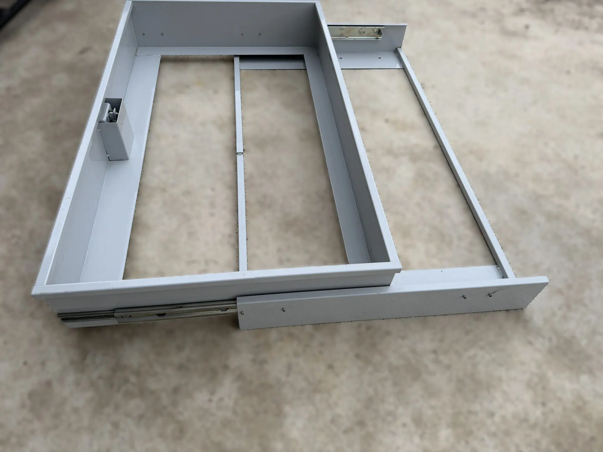Industrial pull out storage drawer unit for RV cargo bay, garage, and shop applications