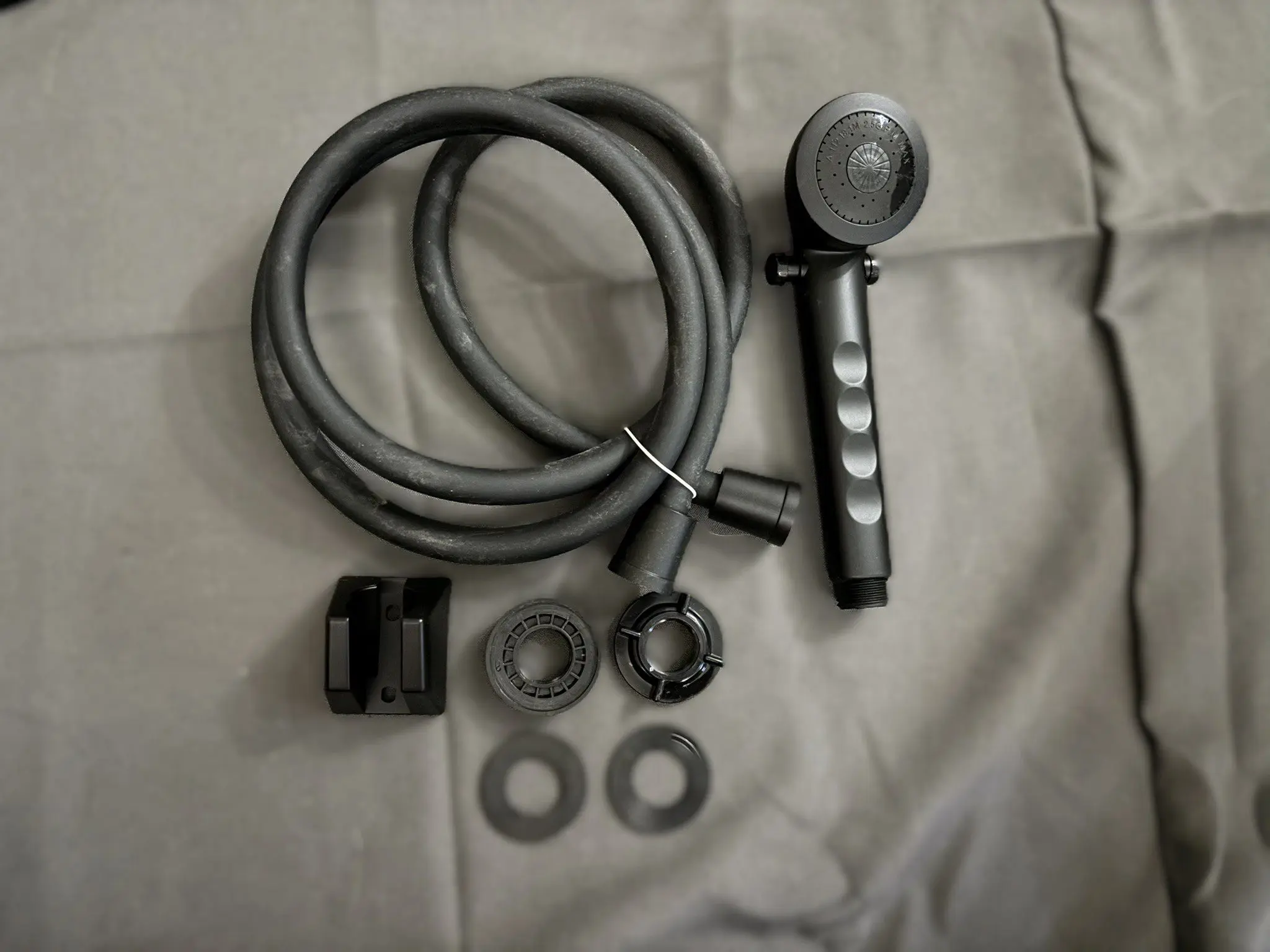 Matte black handheld RV shower head hose mount kit complete with bracket and fittings