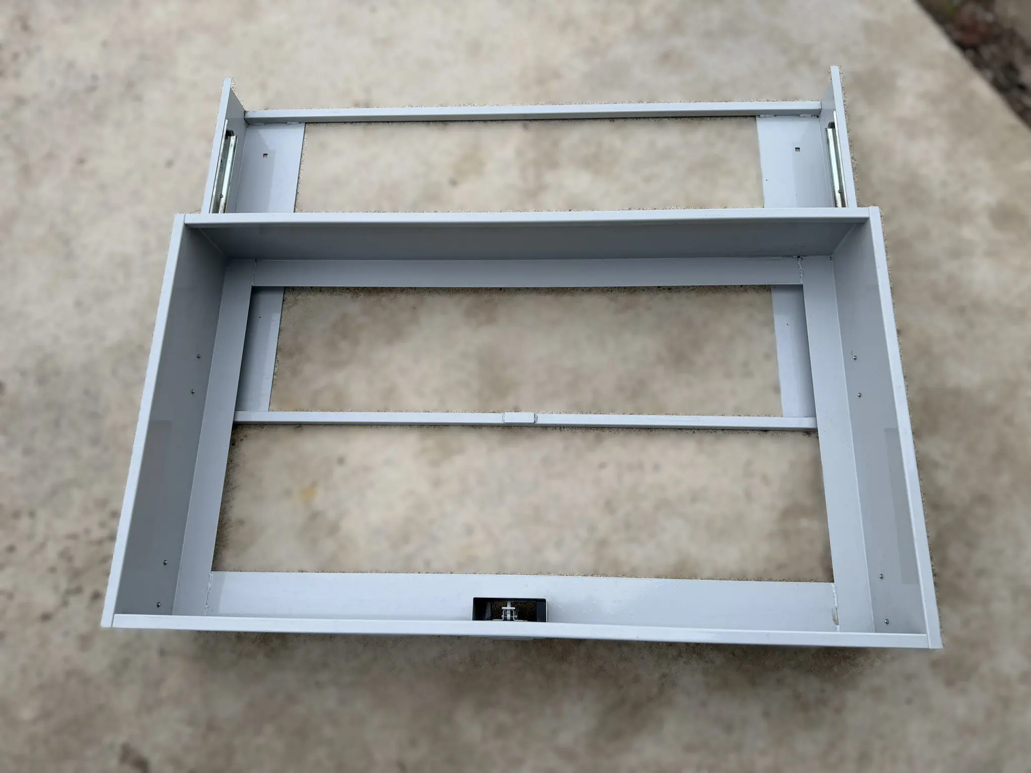 Metal pull out drawer storage unit fully extended on heavy-duty Accuride slides