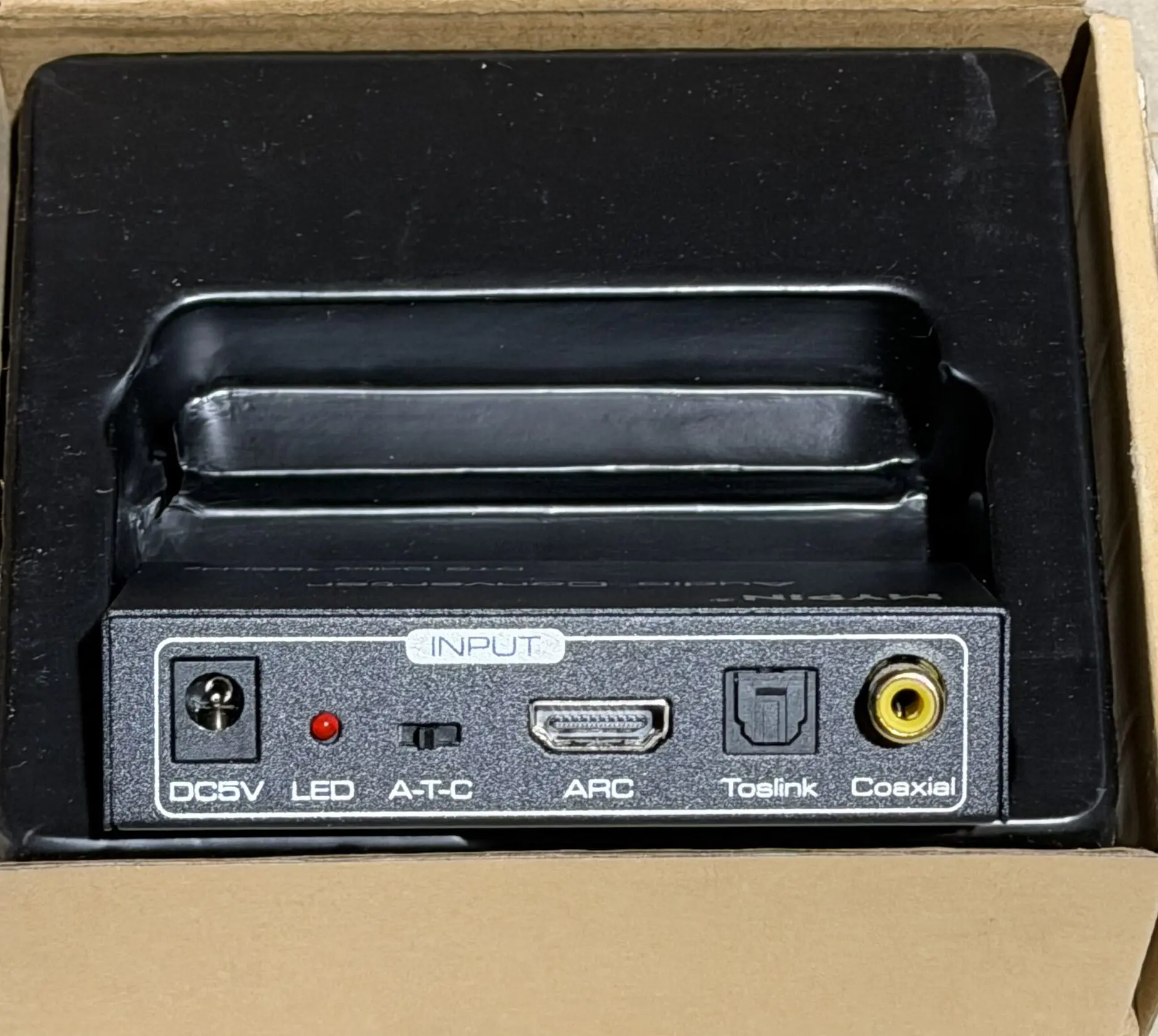 MYPIN audio converter input and output connections closeup showing Toslink, coaxial, and RCA ports