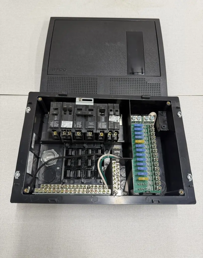 WFCO WF-8930/50 distribution panel loaded with Siemens breakers and DC fuses door open