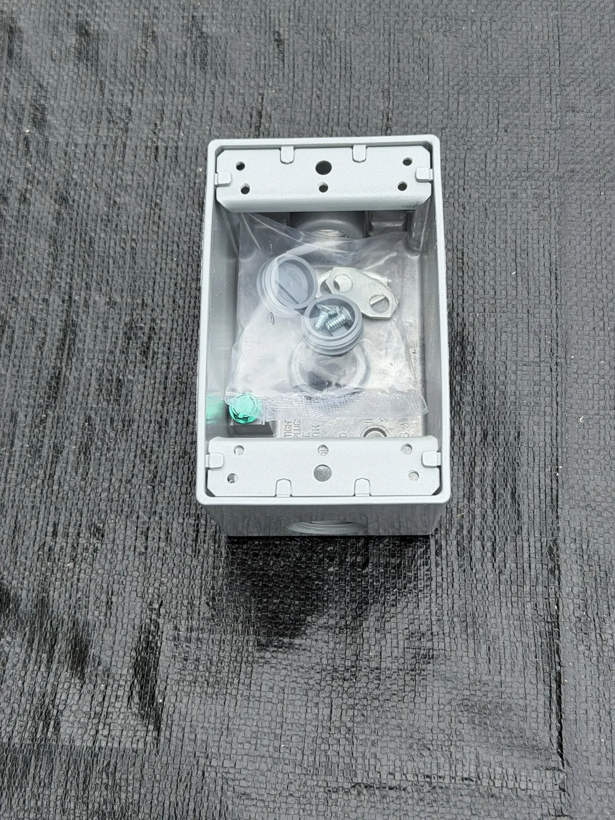 BWF B-5V 1-gang weatherproof box interior with green ground screw, device mounting ears and hardware bag