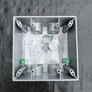 BWF TGB-55V 2-gang weatherproof box interior showing mounting bosses, green ground screws and hardware bag