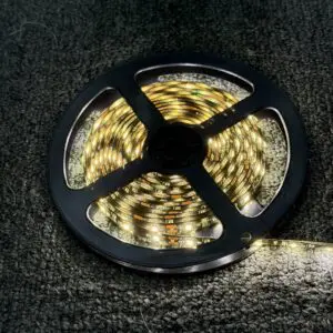 120 inch warm white 12V LED strip light lit up on its reel
