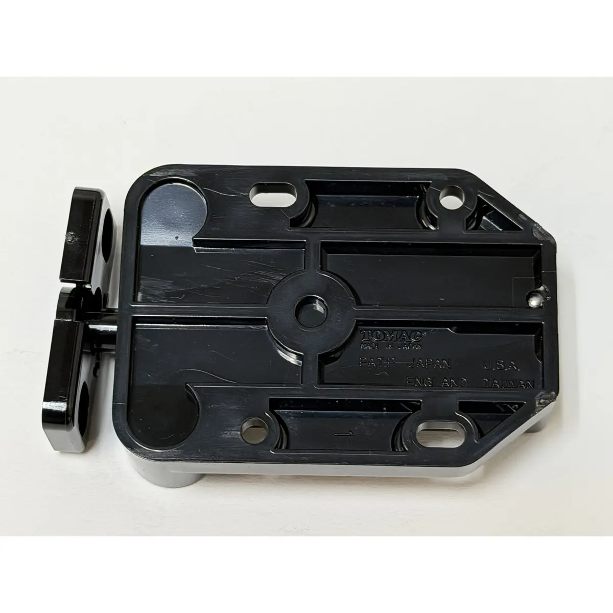 Sugatsune touch latch underside with Japan patent marking
