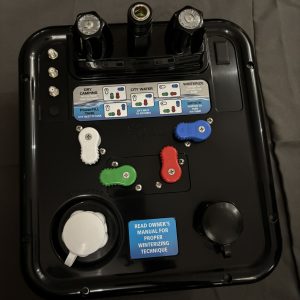 B&B Molders Nautilus P4 H2O RV water control panel in black with color-coded diverter handles