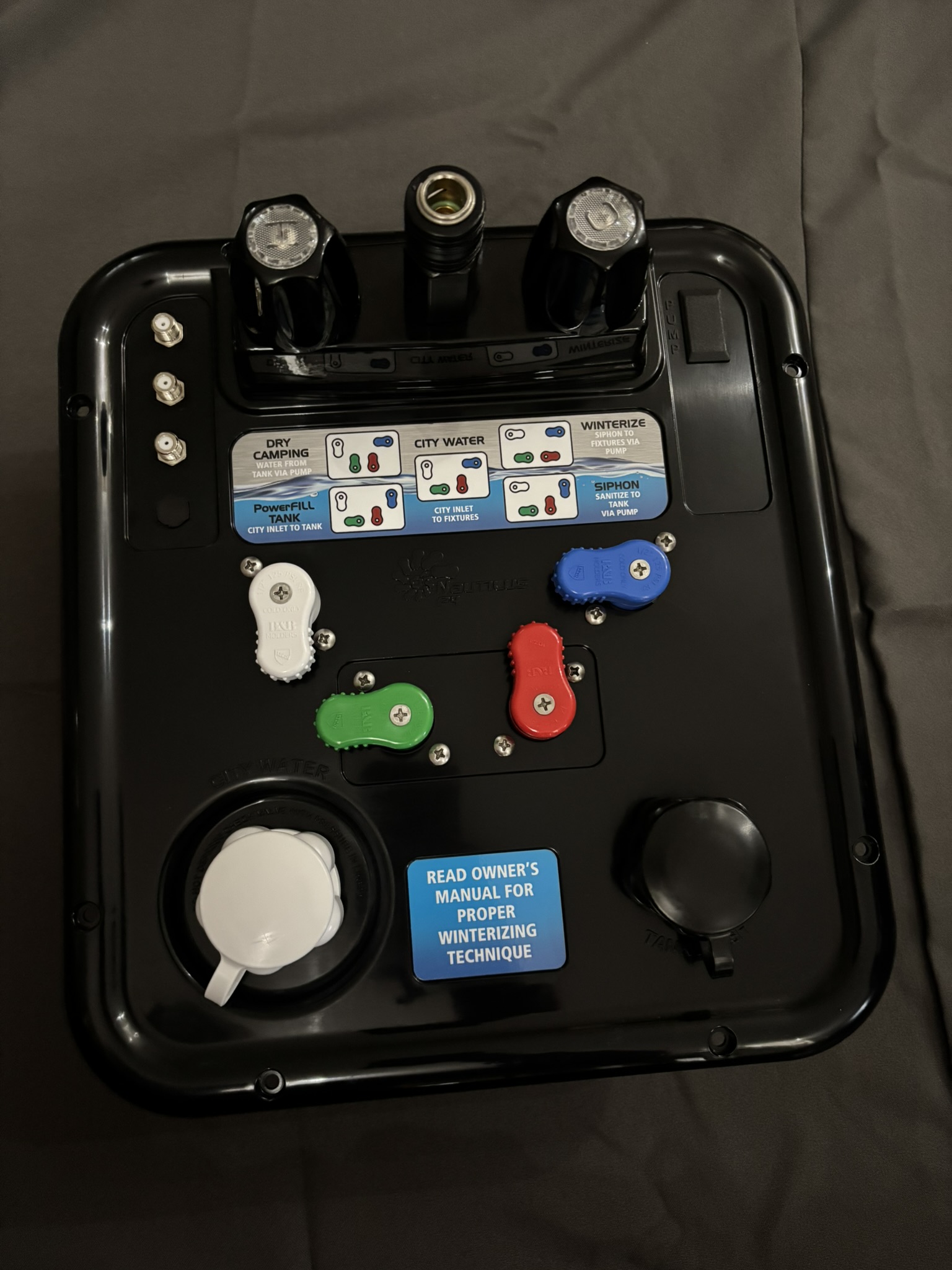 B&B Molders Nautilus P4 H2O RV water control panel in black with color-coded diverter handles